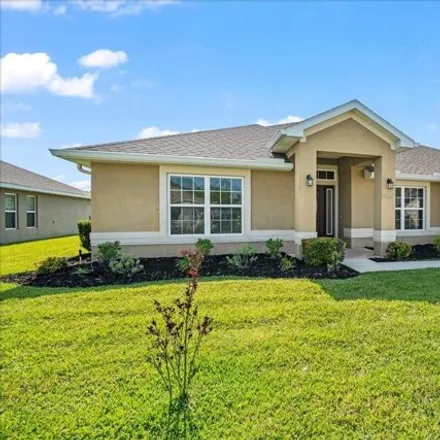Buy this 4 bed house on 444 Pasto Cir Southwest in Palm Bay, FL 32908