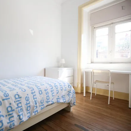 Rent this 4 bed room on Rua António Pedro 109 in 1150-045 Lisbon, Portugal