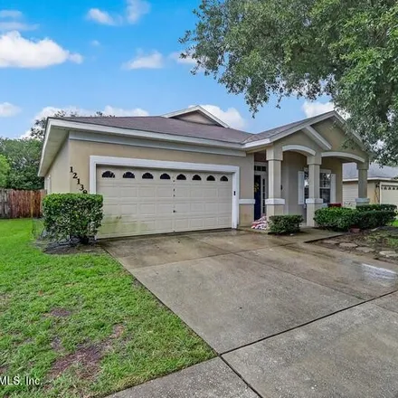 Buy this 4 bed house on 12138 Autumn Sunrise Drive in Jacksonville, FL 32246