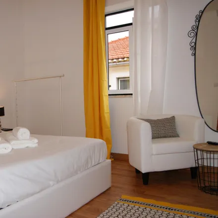 Rent this 4 bed room on Rua do Poço dos Negros 74 in 1200-336 Lisbon, Portugal