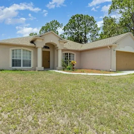Rent this 4 bed house on 582 Justine Avenue Northwest in Palm Bay, FL 32907