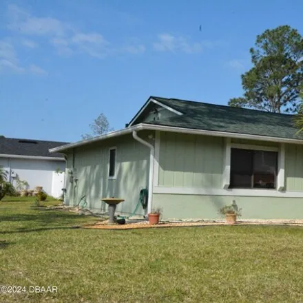 Buy this 2 bed house on 117 Point of Woods Drive in Palm Coast, FL 32164