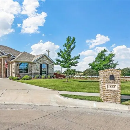 Buy this 4 bed house on 1698 Signature Drive in Weatherford, TX 76087