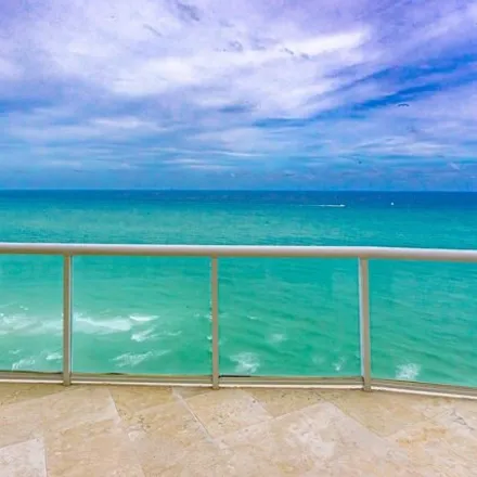 Rent this 4 bed condo on The Millennium in 18671 Collins Avenue, Golden Shores
