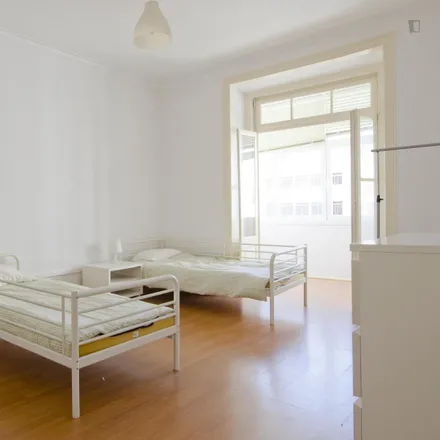 Rent this 6 bed room on Avenida Miguel Bombarda in 1050-167 Lisbon, Portugal