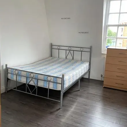 Rent this 5 bed apartment on Pound Saver in Kilburn High Road, London