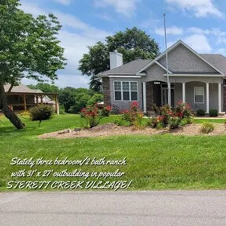 Buy this 3 bed house on 18640 Sterett Creek Village Drive in Benton County, MO 65355