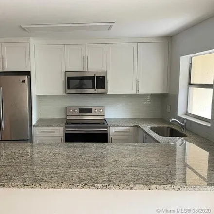 Rent this 3 bed townhouse on 4231 Coral Springs Drive in Kensington Manor, Coral Springs