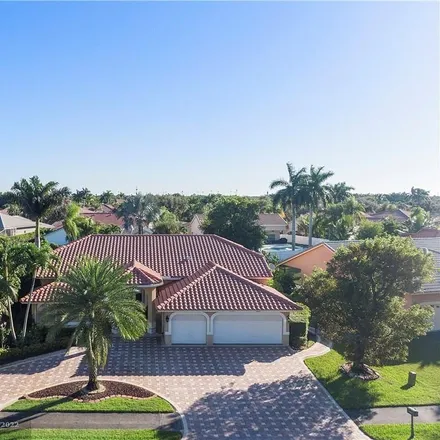 Buy this 5 bed house on 5249 Northwest 109th Lane in Kensington Manor, Coral Springs