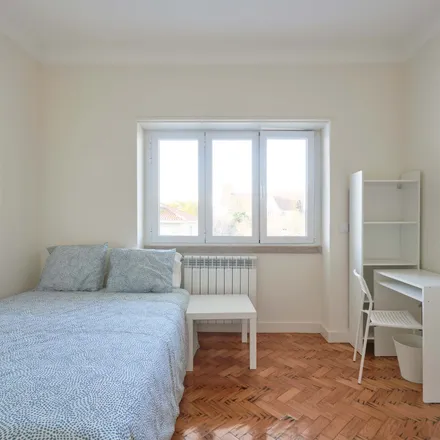 Rent this 14 bed room on Rua Carlos Malheiro Dias 11 in 1700-108 Lisbon, Portugal