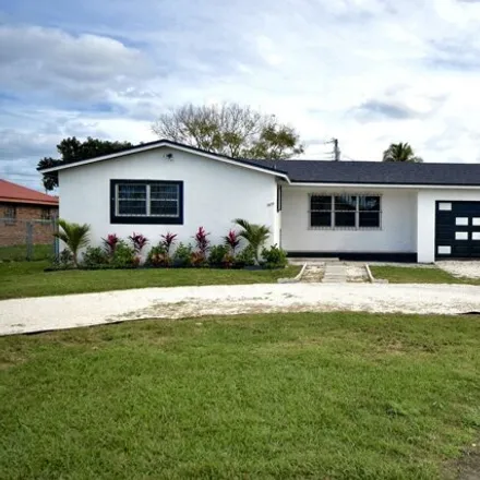 Buy this 3 bed house on 671 Southwest 12th Street in Belle Glade, FL 33430