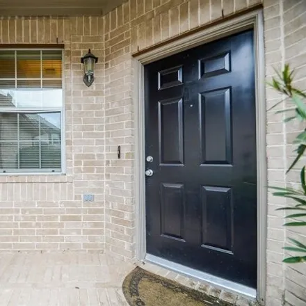 Rent this 2 bed townhouse on 2977 Meadowglen Crest in Houston, TX 77082