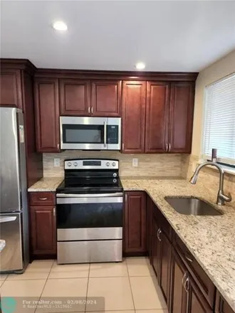 Rent this 2 bed condo on Saint Tropez Access Road in Plantation, FL