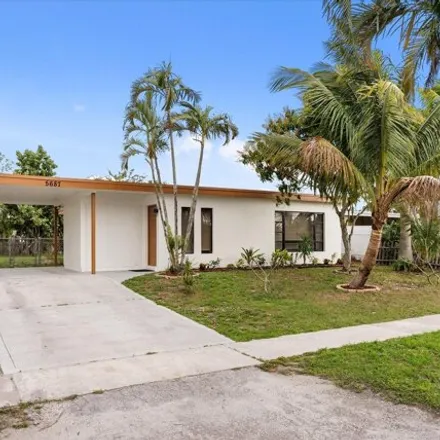 Rent this 3 bed house on 5641 Elder Drive in Palm Beach County, FL 33415