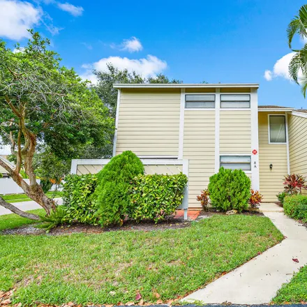 Buy this 2 bed townhouse on 301 Lakewood Drive in West Jupiter, Jupiter