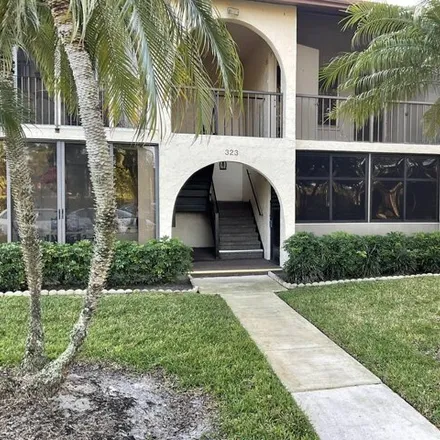 Rent this 2 bed condo on 330 Knotty Pine Circle in Greenacres, FL 33463