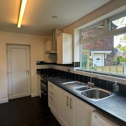 Rent this 3 bed townhouse on Woodhouse Lane in Wythenshawe, M22 1QF