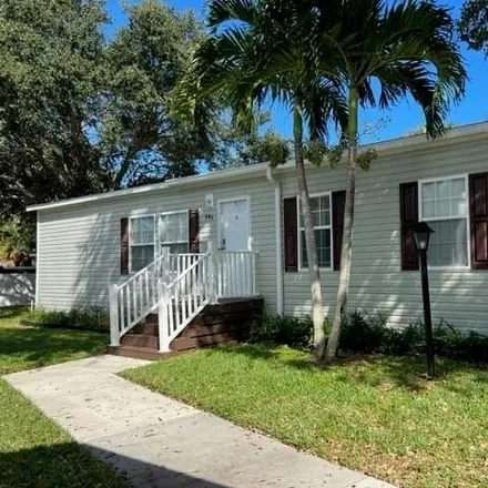 Buy this studio apartment on 51 Meadow Lane West in Palm Beach Gardens, FL 33410