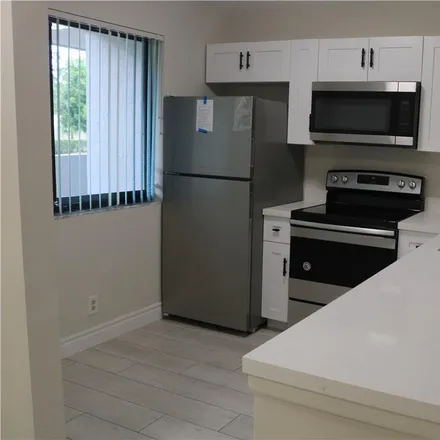 Rent this 2 bed condo on 9519 Southwest 1st Court