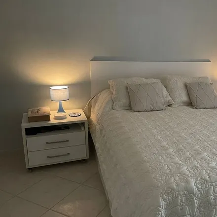 Rent this 4 bed apartment on Bertioga in Região Metropolitana da Baixada Santista, Brazil