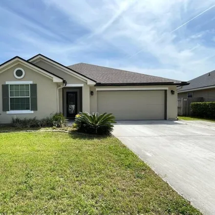 Rent this 4 bed house on 9726 Woodstone Mill Drive in Jacksonville, FL 32244