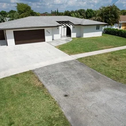 Rent this 3 bed house on 925 Orchid Dr in Royal Palm Beach, Florida