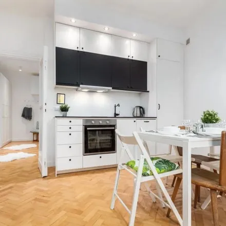 Rent this 3 bed apartment on Warsaw in Rotunda PKO, Marszałkowska 100/102
