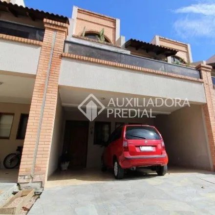 Buy this 4 bed house on unnamed road in Pedra Redonda, Porto Alegre - RS