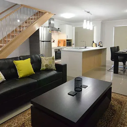 Rent this 3 bed townhouse on Side Street in West Gladstone QLD 4680, Australia