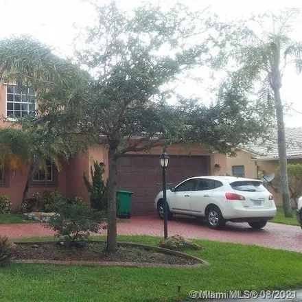 Rent this 4 bed house on 8993 Northwest 53rd Street in Ridgeview, Coral Springs