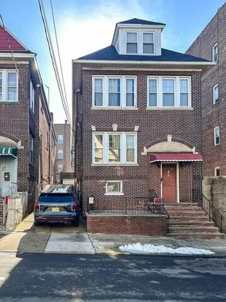 Buy this 11 bed house on 165 Orient Avenue in West Bergen, Jersey City