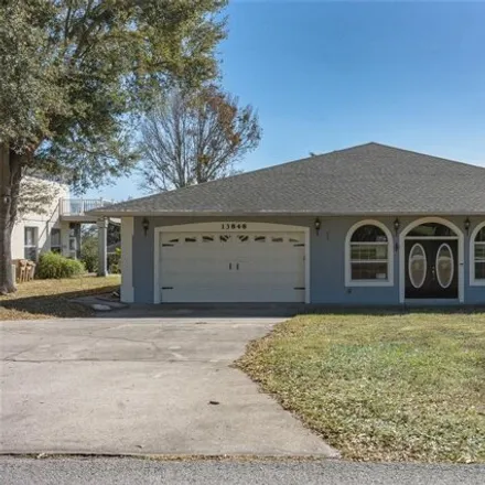 Rent this 4 bed house on 13848 Vista del Lago Boulevard in Orange Mountain, Clermont