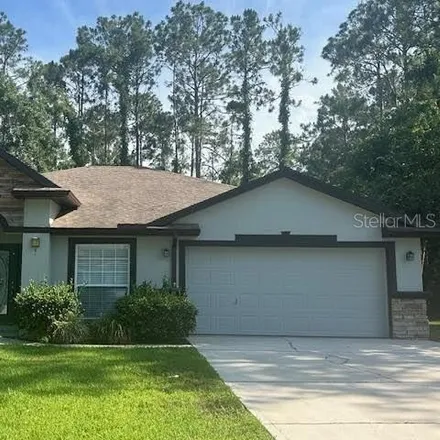 Rent this 4 bed house on 31 Rymer Lane in Palm Coast, FL 32164