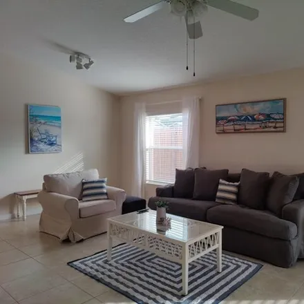 Rent this 3 bed house on 5819 Southeast Mitzi Lane in Port Salerno, FL 34997