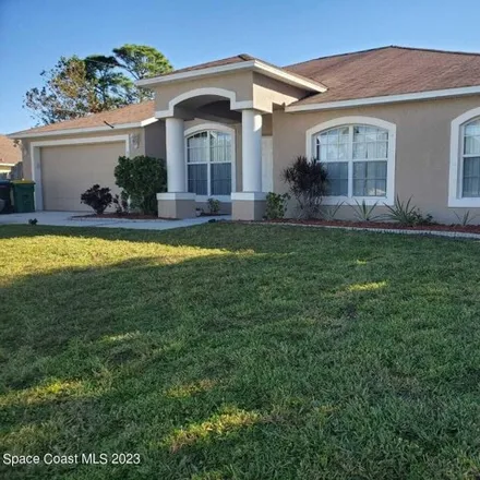 Buy this 4 bed house on 383 Carvalho Street Southeast in Palm Bay, FL 32909