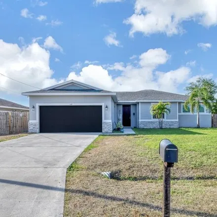 Buy this 4 bed house on 551 Southwest Halkell Avenue in Port Saint Lucie, FL 34953