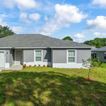 Buy this 4 bed house on 1125 Tiger Street Southeast in Palm Bay, FL 32909