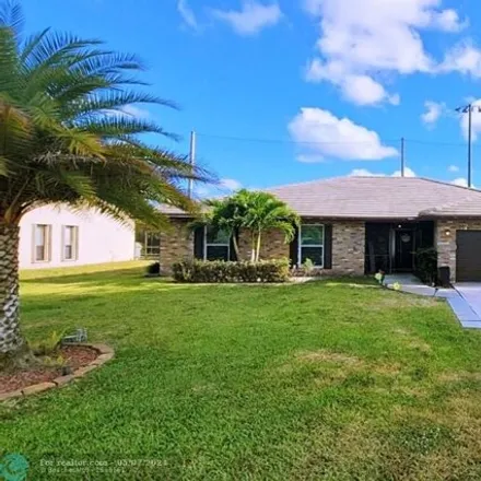 Buy this 3 bed house on 7010 Nw 38th St in Coral Springs, Florida