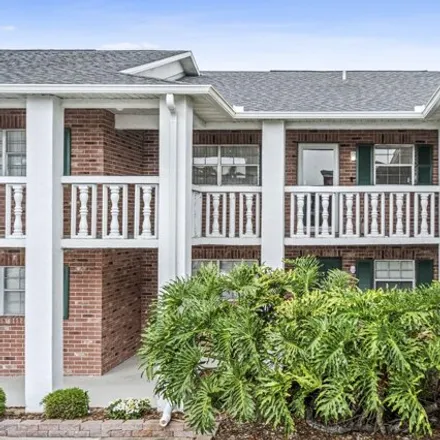 Buy this 2 bed condo on Royal Oak Golf Club (closed) in Zaharis Place, Titusville