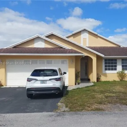 Buy this 4 bed house on 18678 Northwest 77th Place in Hialeah Gardens, FL 33015