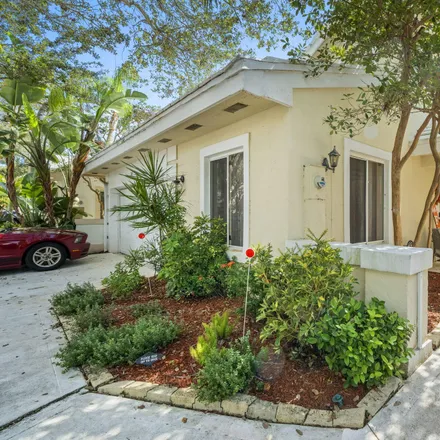 Buy this 4 bed house on 218 Canterbury Drive West in Palm Beach Gardens, FL 33418