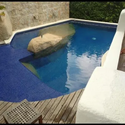 Rent this 4 bed house on Privada Sendero del Poseidón in Fraccionamiento Marina Brisas, 39300 Acapulco