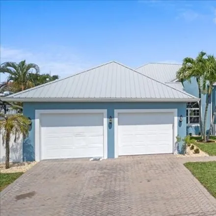 Buy this 5 bed house on 189 Boca Ciega Road in Cocoa Beach, FL 32931