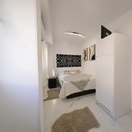 Rent this 16 bed room on Calle de Gijón in 28011 Madrid, Spain