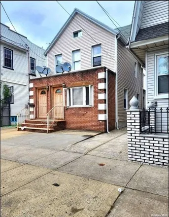 Buy this 4 bed house on 86-27 125th Street in New York, NY 11418