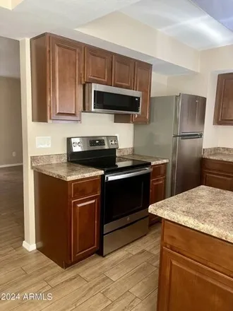 Rent this 2 bed apartment on 4554 E Paradise Village Pkwy N Unit 122 in Phoenix, Arizona