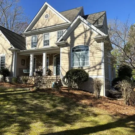 Buy this 4 bed house on 5127 Sunset Fairways Drive in Holly Springs, NC 27540