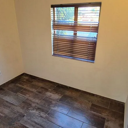 Rent this 3 bed townhouse on Isipingo Road in Paulshof, Sandton