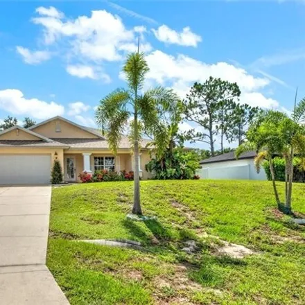 Buy this 3 bed house on 900 Angelo Ave in Lehigh Acres, Florida
