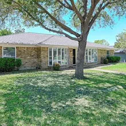 Buy this 4 bed house on 2718 South Surrey Drive in Carrollton, TX 75006